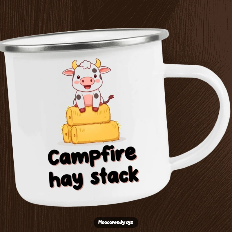Funny camping mug depicting a happy cow character struggling to balance a stack of hay bales in a rustic setting.